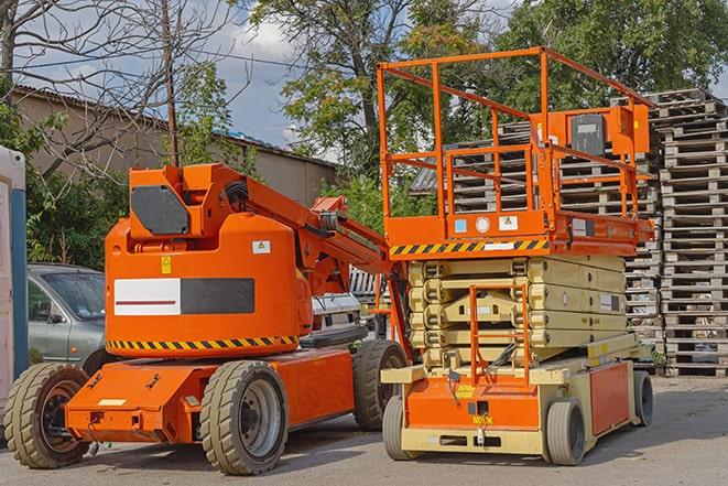 forklift transporting goods in a busy warehouse setting in Belews Creek, NC